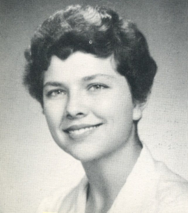 Jessica Heimbach Raymond is a woman white short brown hair smiling. 